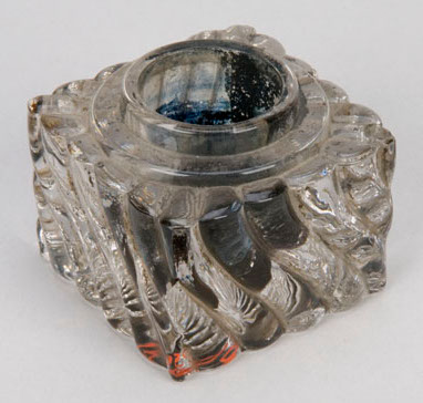 Old glass inkwell with dried ink within
